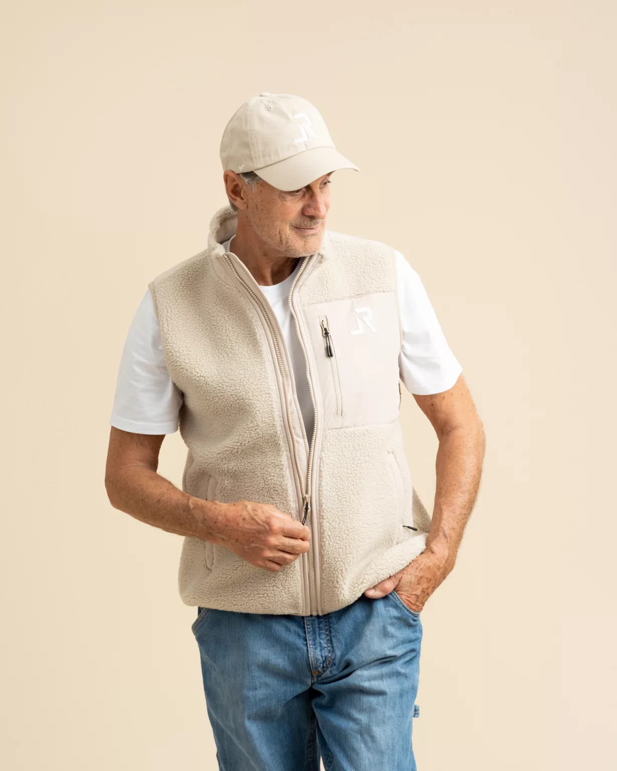 Man wearing a sustainable, fair-produced teddy vest from LavendersRanch (LR) made from 100% recycled polyester. Perfect for outdoor and casual western style.