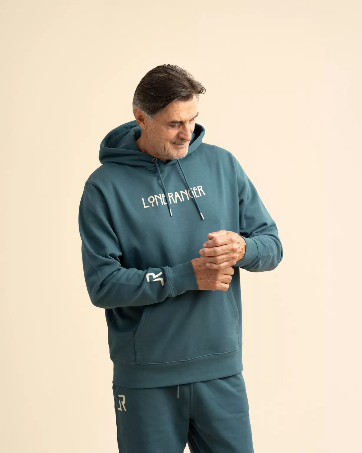 Teal-blue hoodie from LavendersRanch (LR) with 'Lone Ranger' print, made from 100% organic cotton, sustainably and fairly produced.