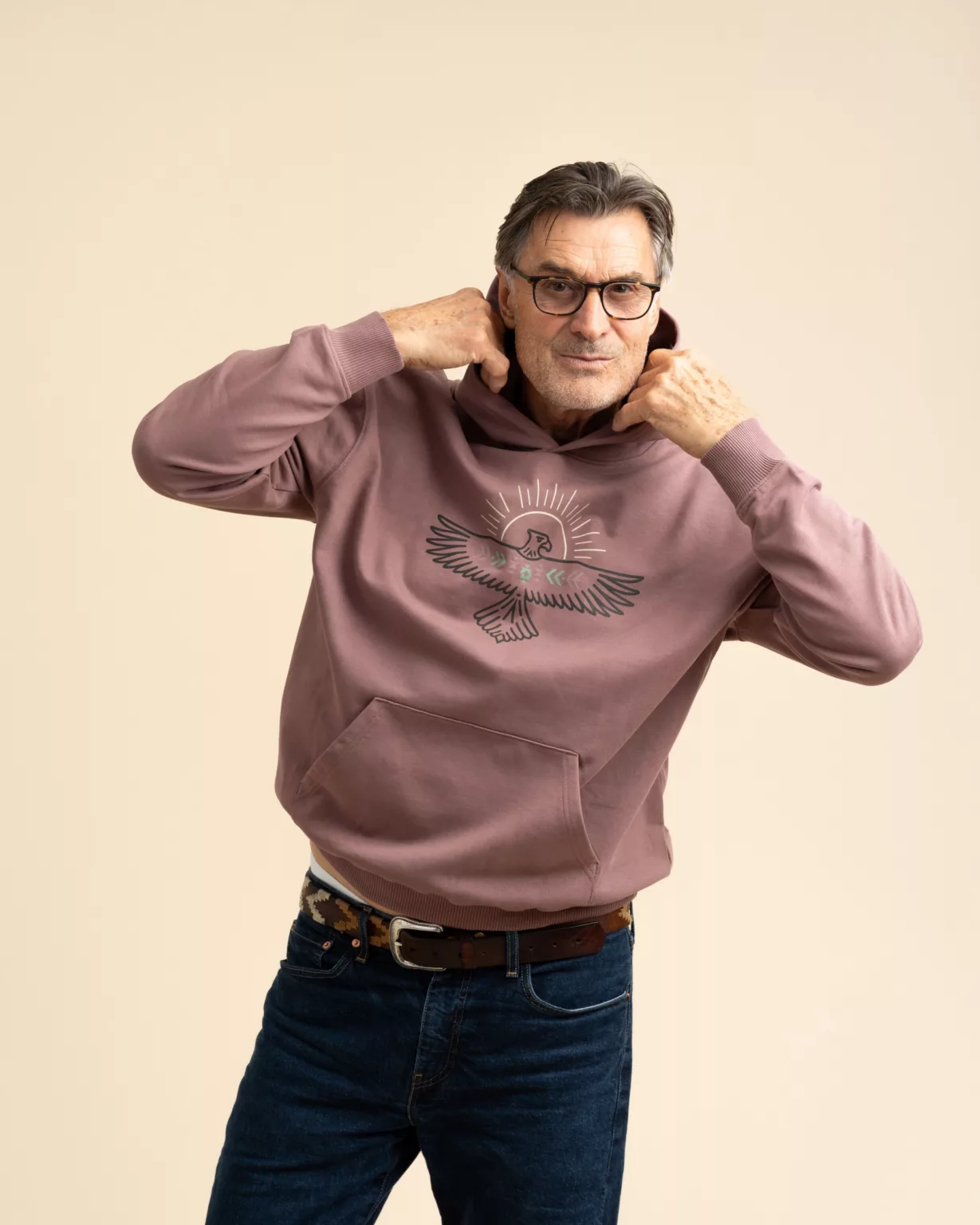 Man wearing the FREEBIRD oversized hoodie in rosewood by LavendersRanch (LR), styled with denim jeans, showcasing western fashion and relaxed country lifestyle apparel.