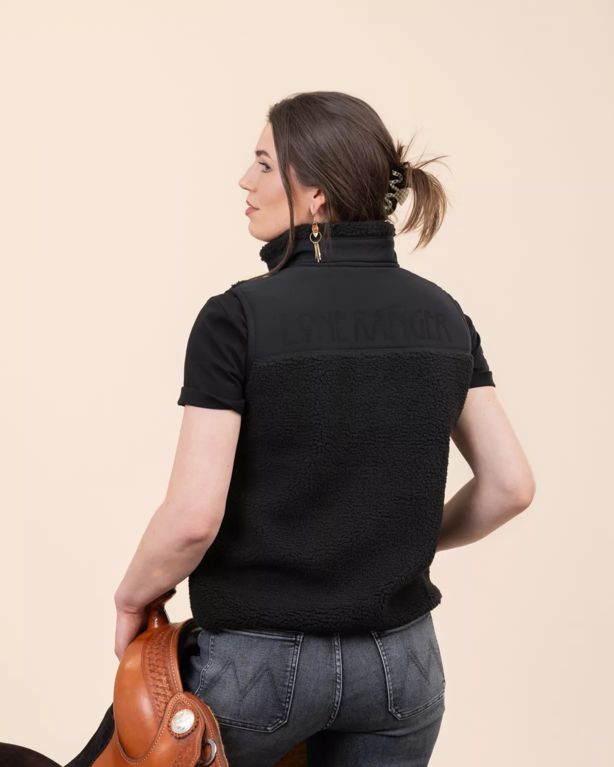 Back view of the black sherpa vest by LavendersRanch (LR) made from recycled polyester with Lone Ranger lettering, western country style.