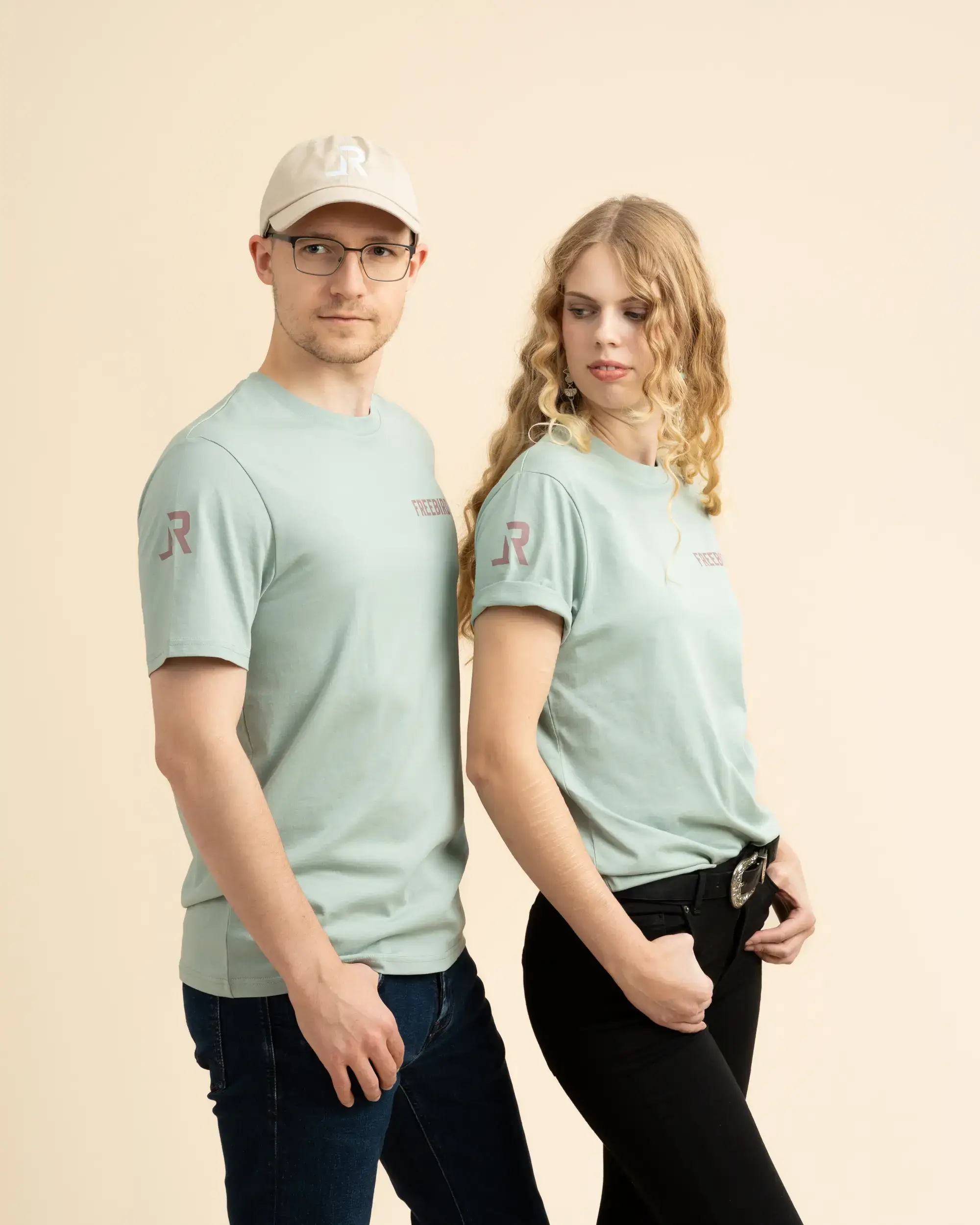 Two people wearing LavendersRanch (LR) T-shirts – sustainably and fairly produced, unisex, high-quality “LR” print on sleeve, modern Western style
