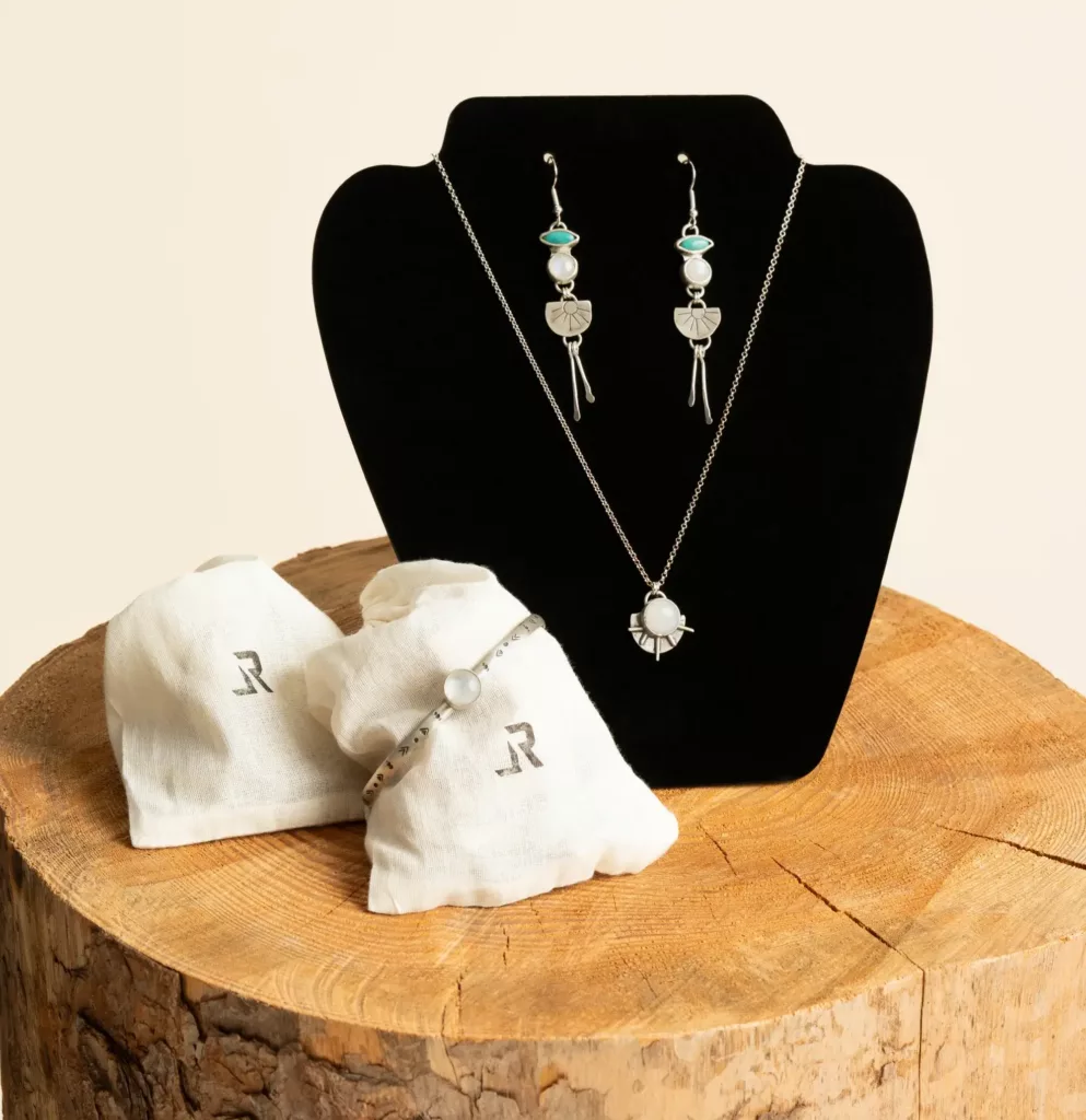 Handcrafted Moonshine silver jewelry set by LavendersRanch (LR) made of 925 sterling silver featuring earrings with turquoise from a small mine in Mexico and rainbow moonstone, a matching moonstone necklace, and a sterling silver bracelet, shown as a complete set.